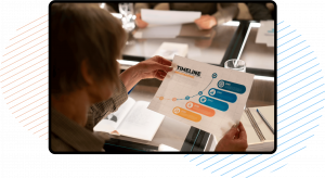 women holding business timeline paper