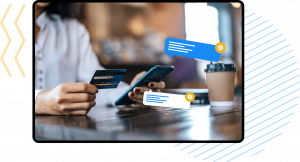 women on phone paying with her card