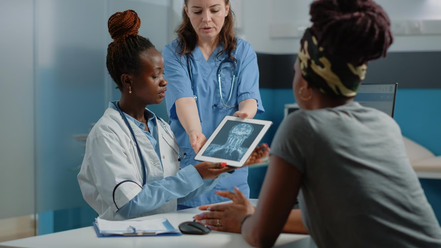 nurses working with patient